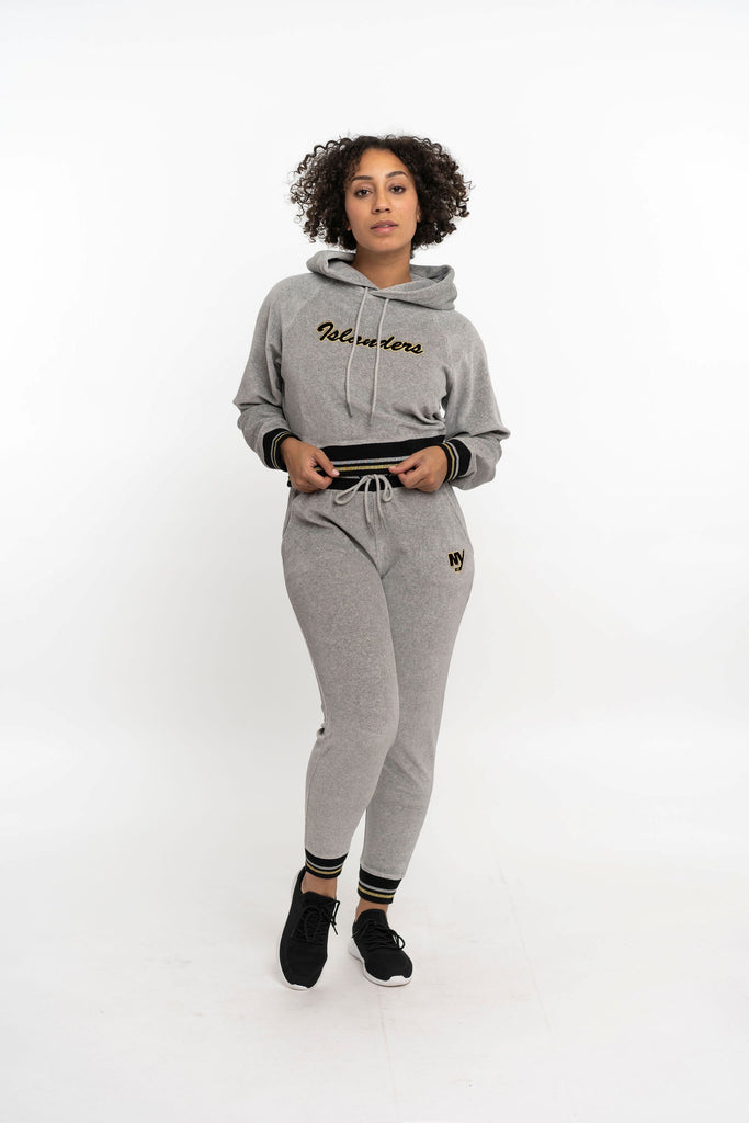 New York Islanders grey velor cropped sweatshirt with black and gold script and silver, black, and gold stripe on model