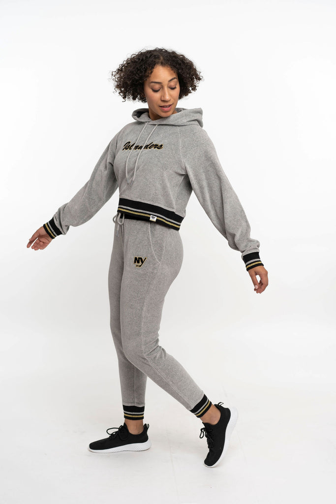 New York Islanders NY grey velor sweatpant with black, silver, and gold stripe on model